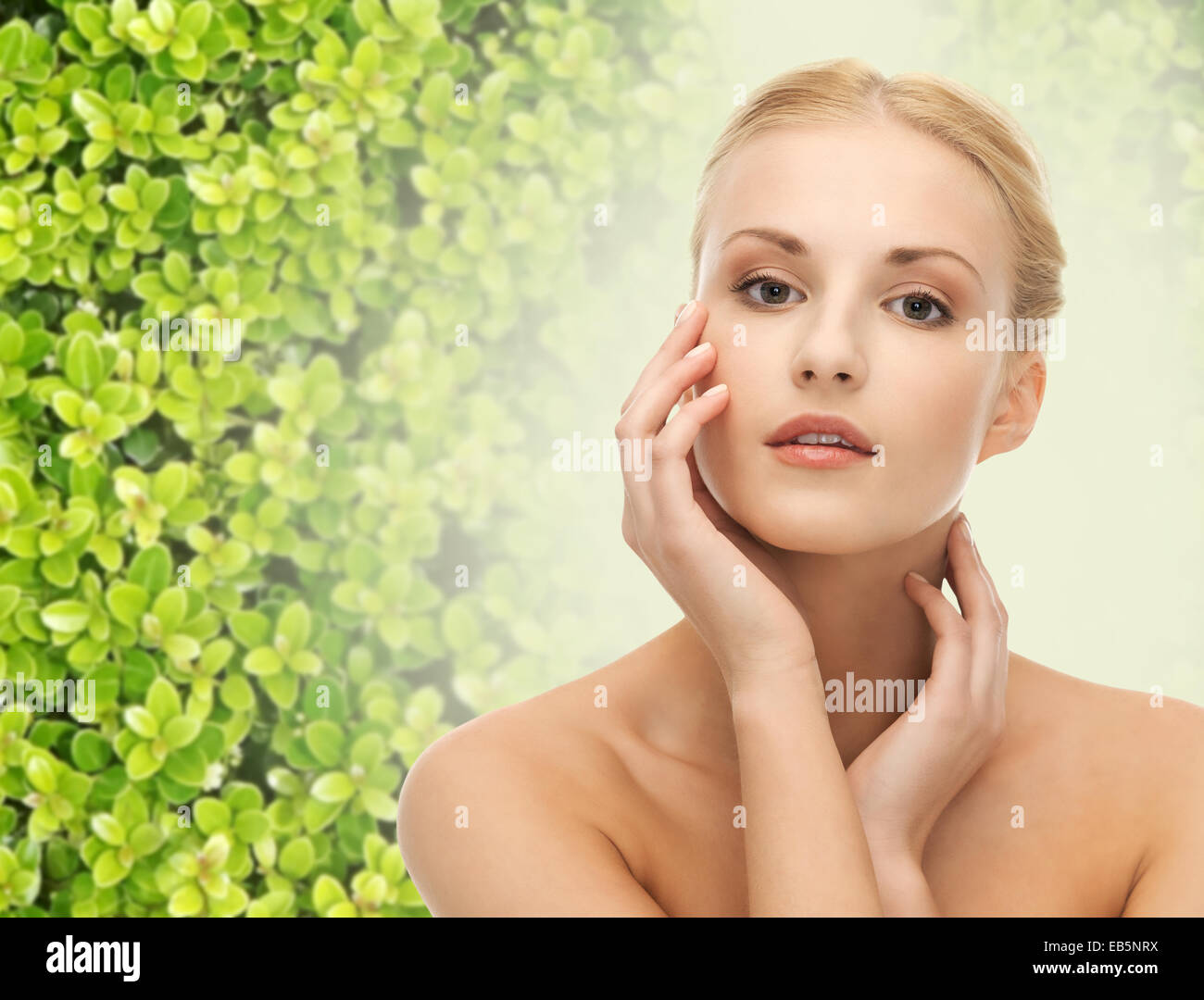 beautiful young woman touching her face skin Stock Photo - Alamy