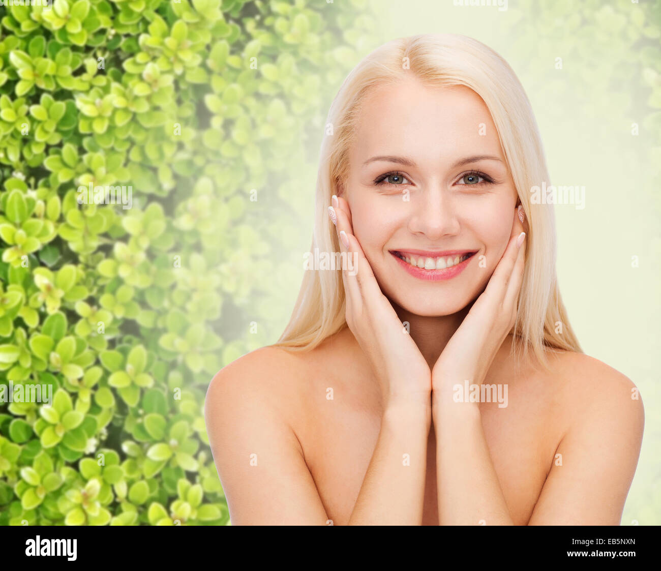 beautiful young woman touching her face skin Stock Photo - Alamy
