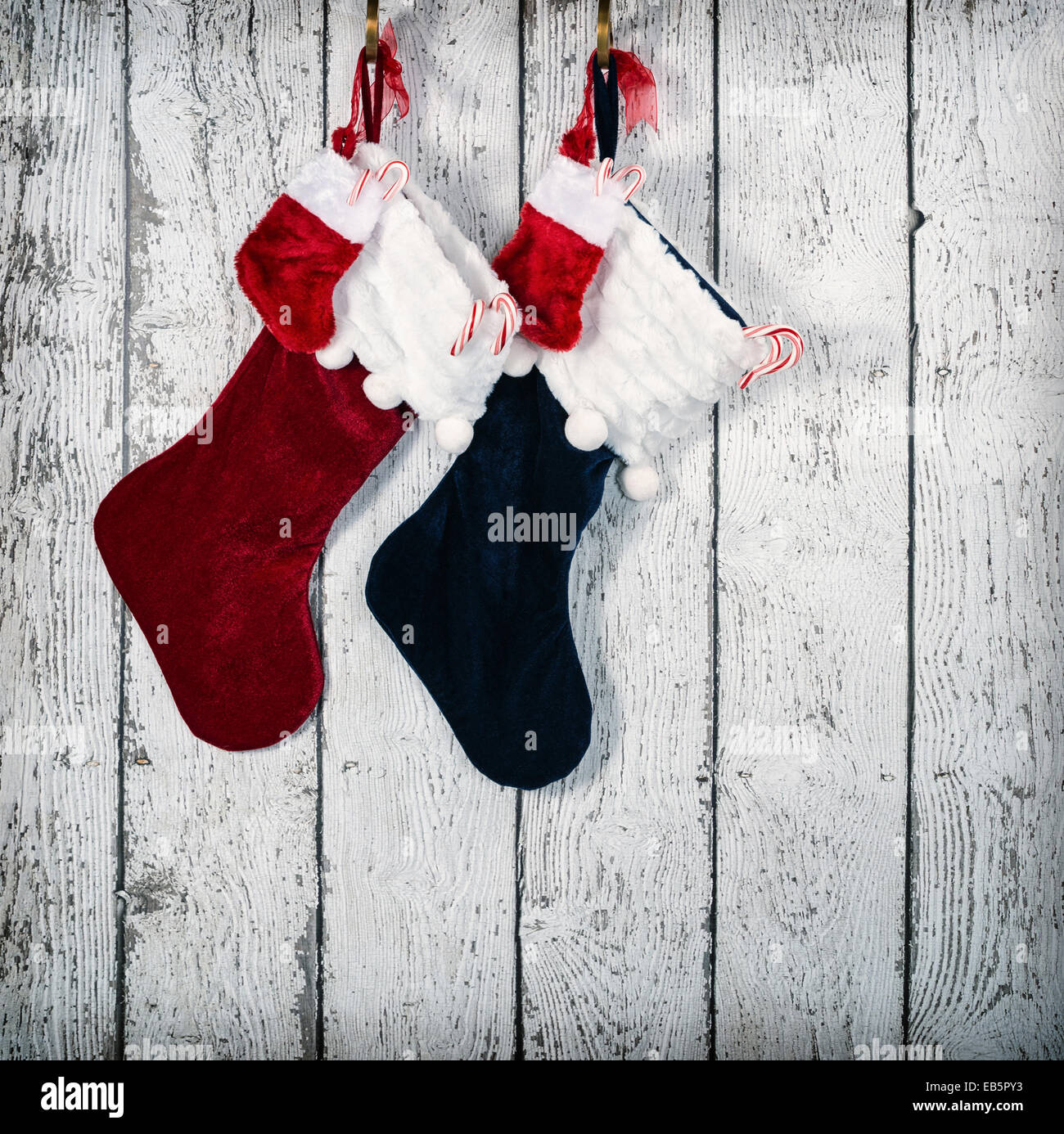 Christmas stocking hanging against rustic wood background Stock Photo