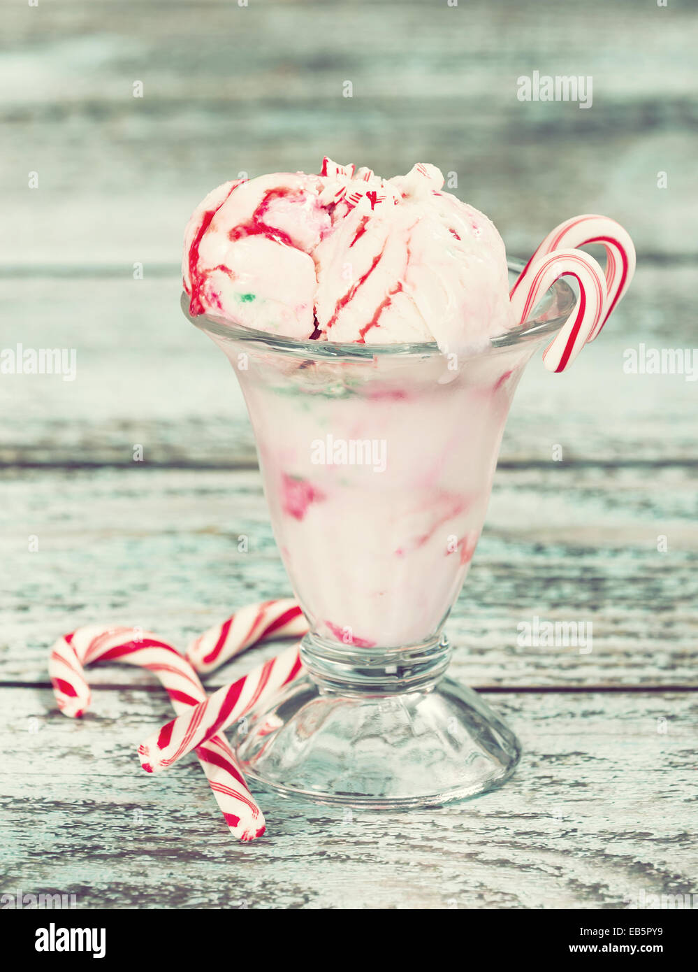 Peppermint ice cream with candy canes in a glass bowl Stock Photo Alamy