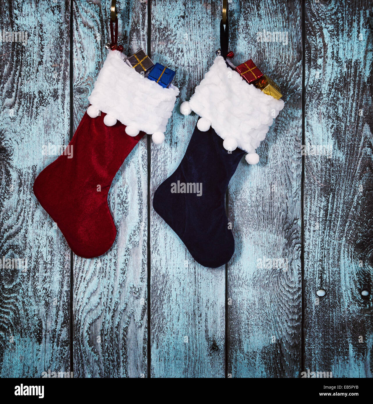 Christmas stocking hanging against rustic wood background Stock Photo