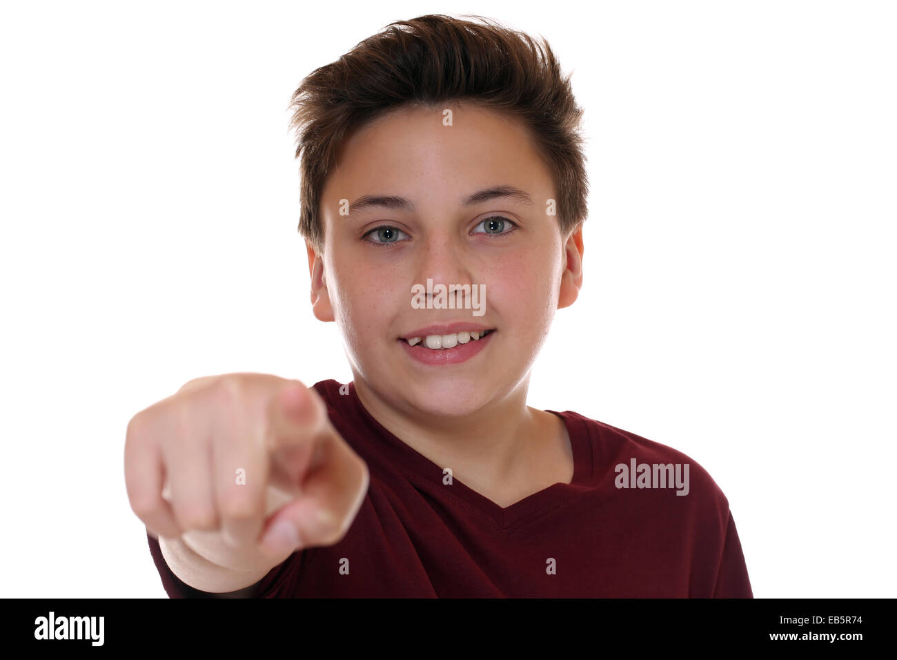 Teenager boy makes a decision by choosing, searching and finding isolated on a white background Stock Photo
