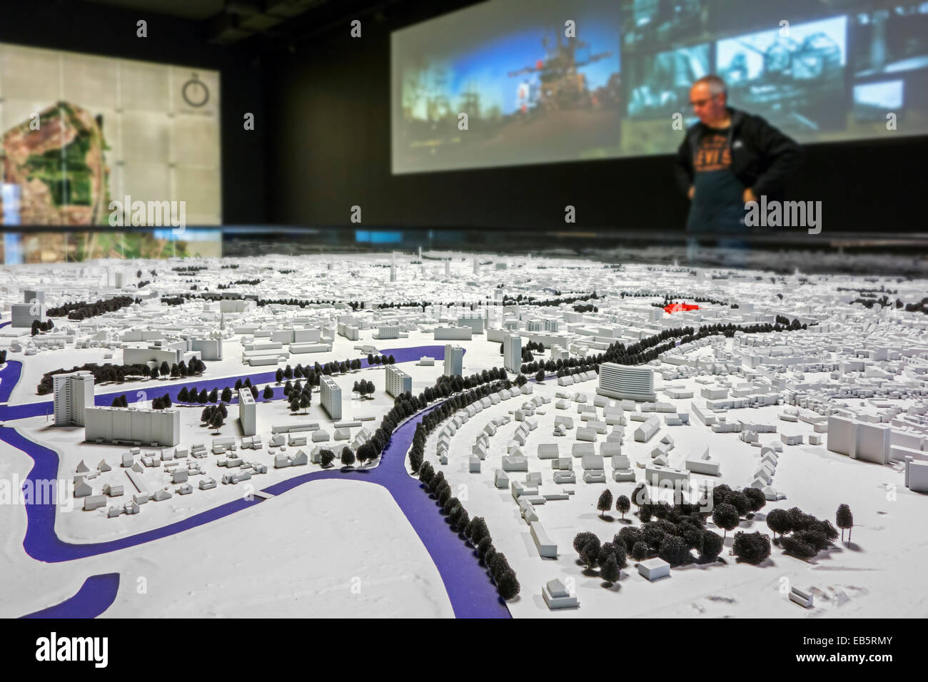 Tourist looking at scale-model of the town Ghent at STAM, the Ghent city museum, Belgium Stock Photo