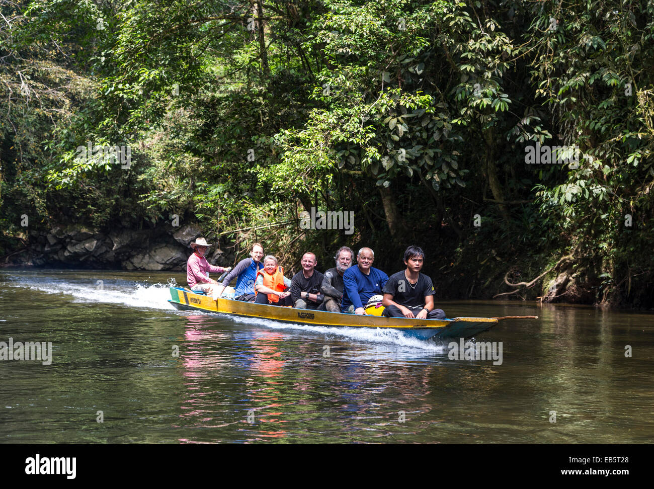Tourists in boat on Melinau River, Mulu, Malaysia Stock Photo