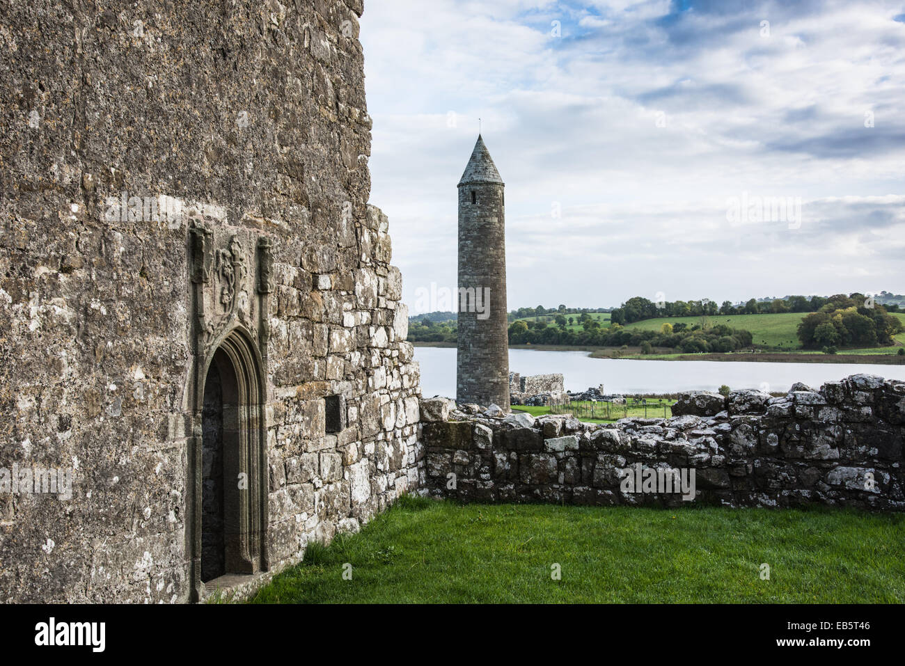 Oratory of Saint Molaise & Round Tower, St Mary's Augustinian Priory, Devenish Island, County Fermanagh, Northern Ireland. Stock Photo