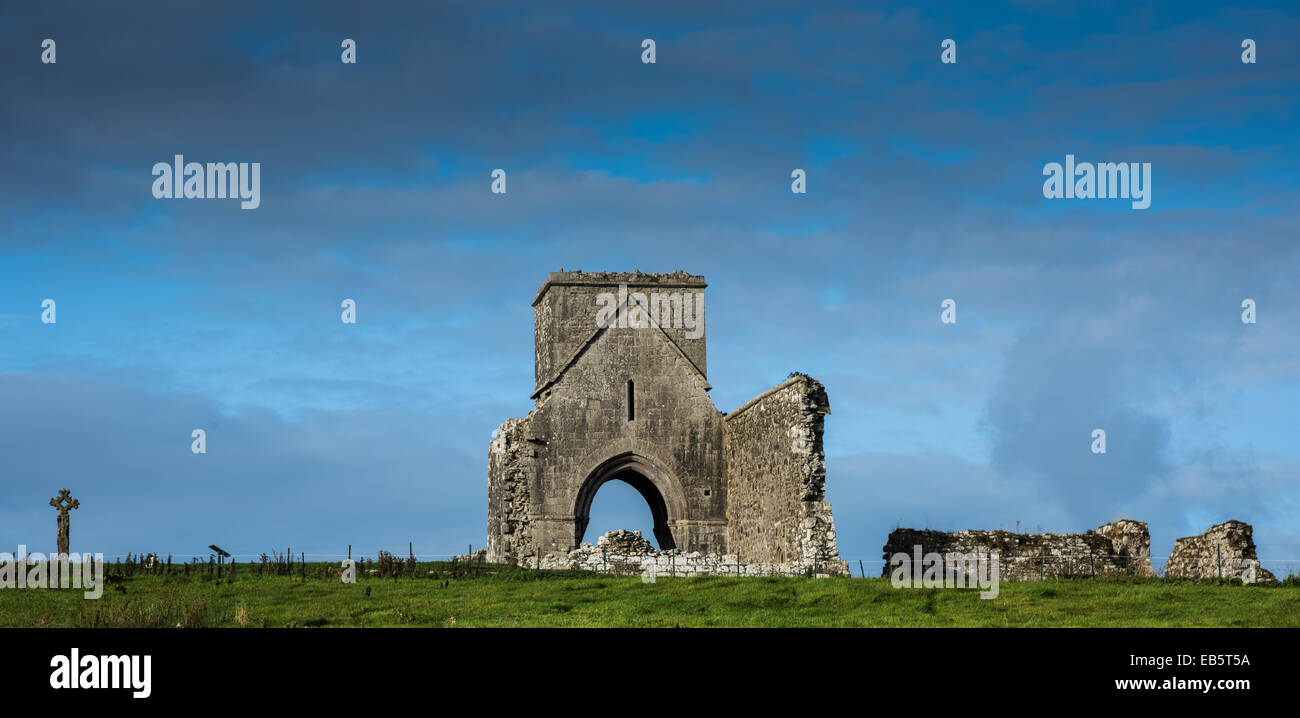 Oratory of Saint Molaise & stone cross, St Mary's Augustinian Priory, Devenish Island, County Fermanagh, Northern Ireland. Stock Photo