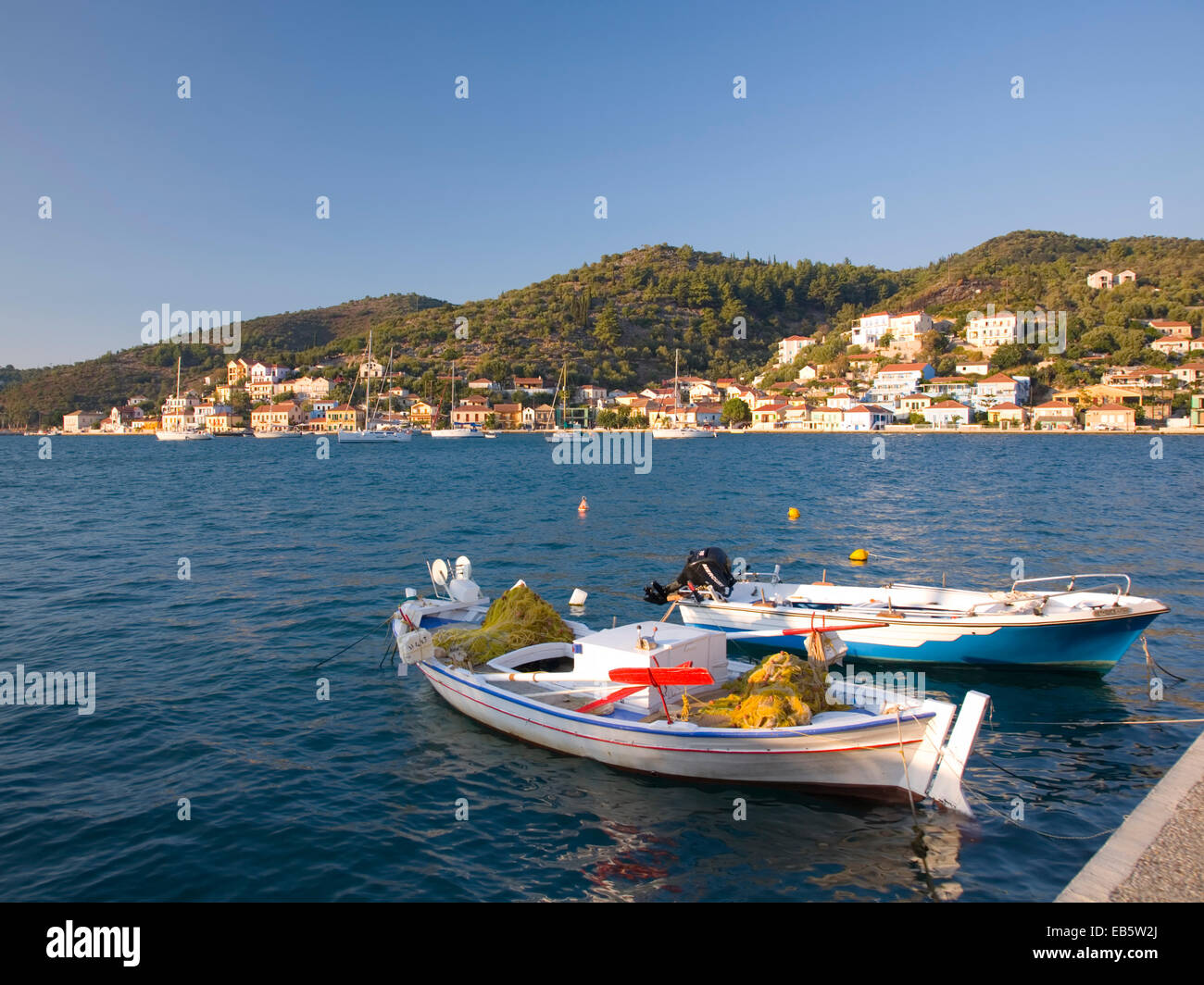 Vathy, Ithaca, Ionian Islands, Greece. View across the harbour, fishing boats in foreground. Stock Photo