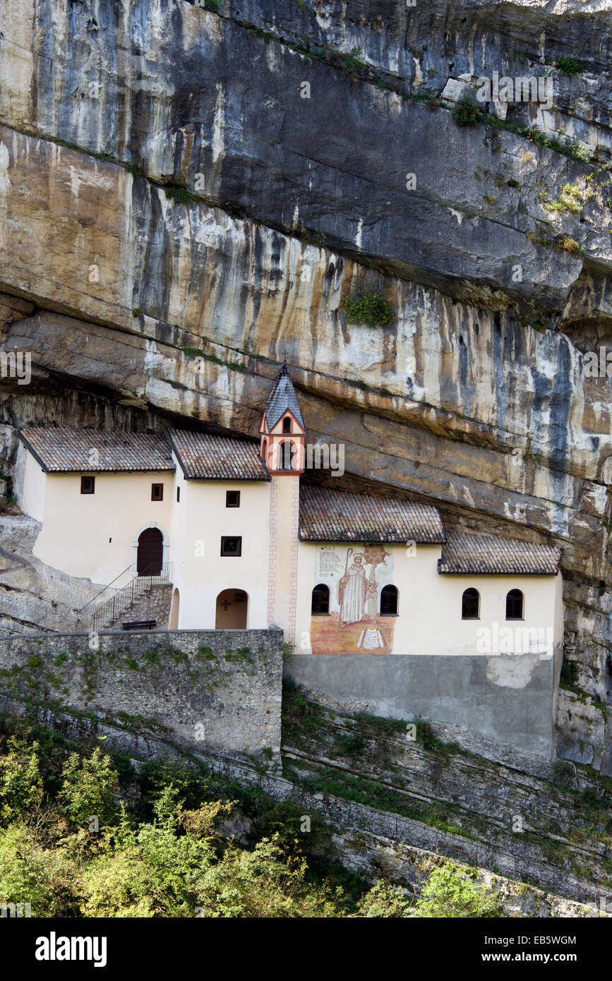 Hermitage of San Colombano built in cliff face Trambileno Trentino Northern Italy Stock Photo