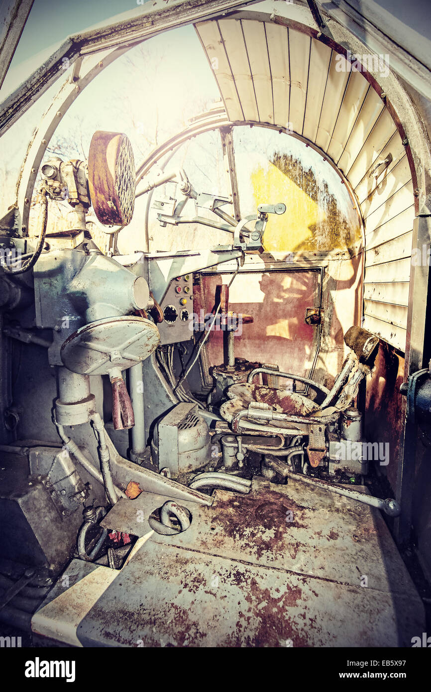 Retro filtered picture of machine gun cockpit. Stock Photo