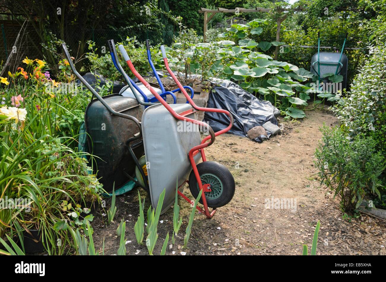 Workplace in  a garden with wheelbarrows. Design: Marianne and Detlef Lüdke Stock Photo
