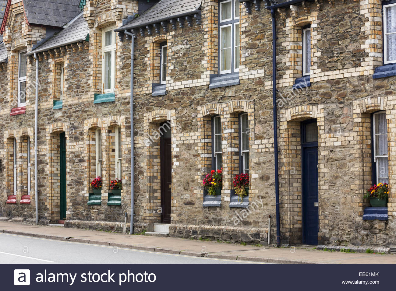 Brick and stone terraced houses with no front garden, Ilfracombe, Devon Stock Photo