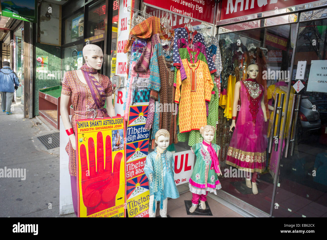 Clothing and an astrologer share a storefront in the Jackson Heights  neighborhood of Queens in New York Stock Photo - Alamy