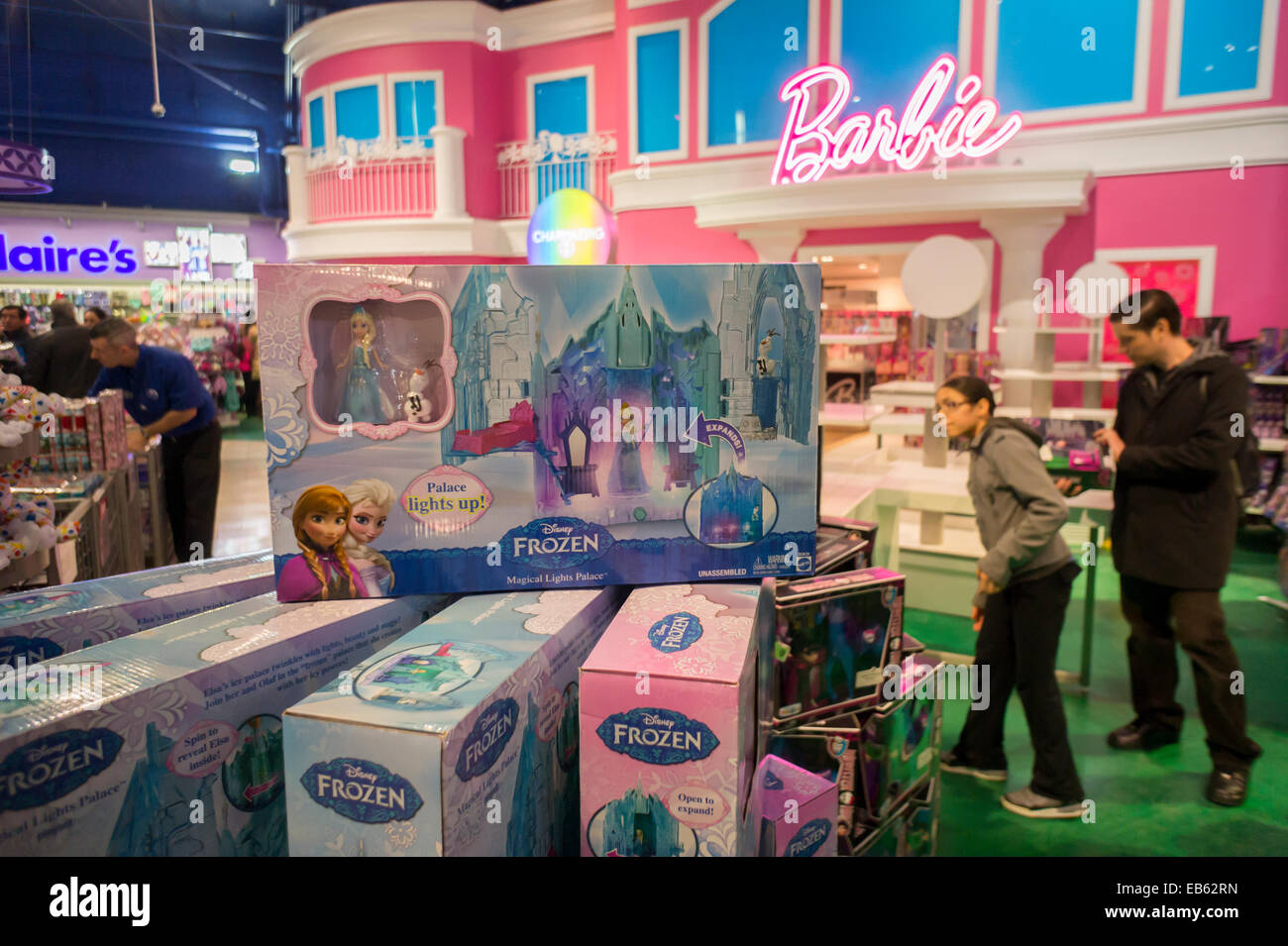 Disney's Frozen merchandise is seen in front of the Barbie display at Toys R Us in Times Square in New York Stock Photo