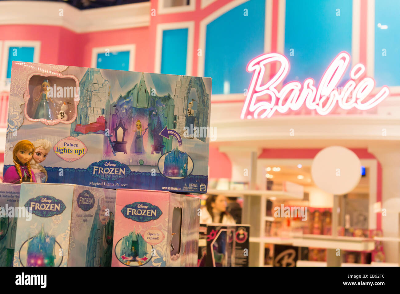 Disney's Frozen merchandise is seen in front of the Barbie display at Toys R Us in Times Square in New York Stock Photo