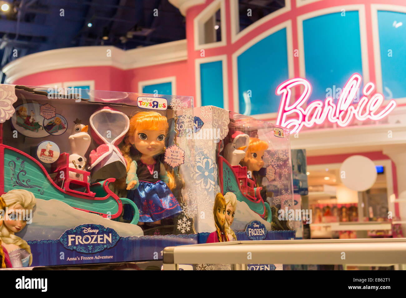 Disney's Frozen merchandise is seen in front of the Barbie display at Toys R Us in Times Square in New York Stock Photo