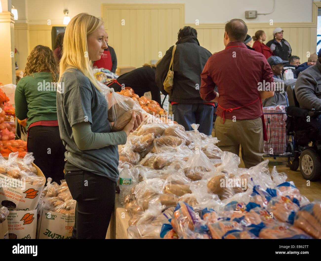 Volunteers distribute turkeys, stuffing and all the other "fixin's" for