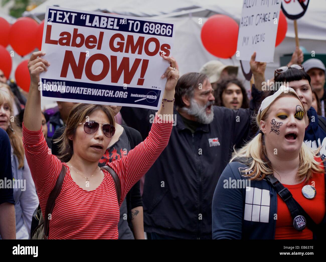 Protesters demonstrate against foods containing Genetically Modified Organisms (GMOs) in New York City, many with homemade signs  Featuring: Atmosphere Where: New York City, New York, United States When: 24 May 2014 Stock Photo