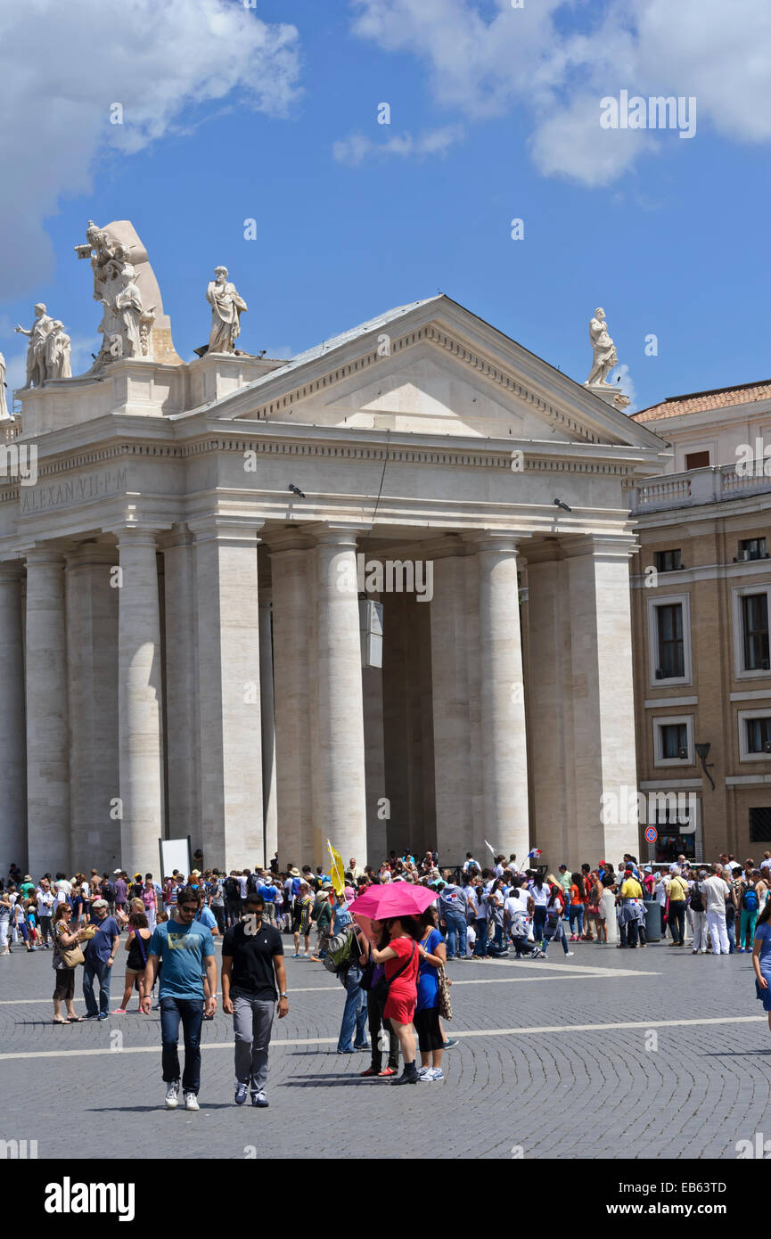 Tourists visiting the iconic square with its huge white columns and ...