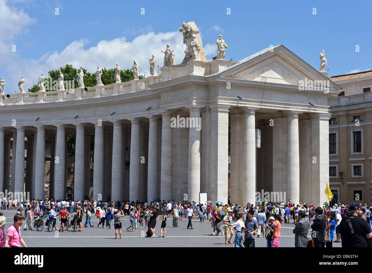 Tourists visiting the iconic square with its huge white columns and ...