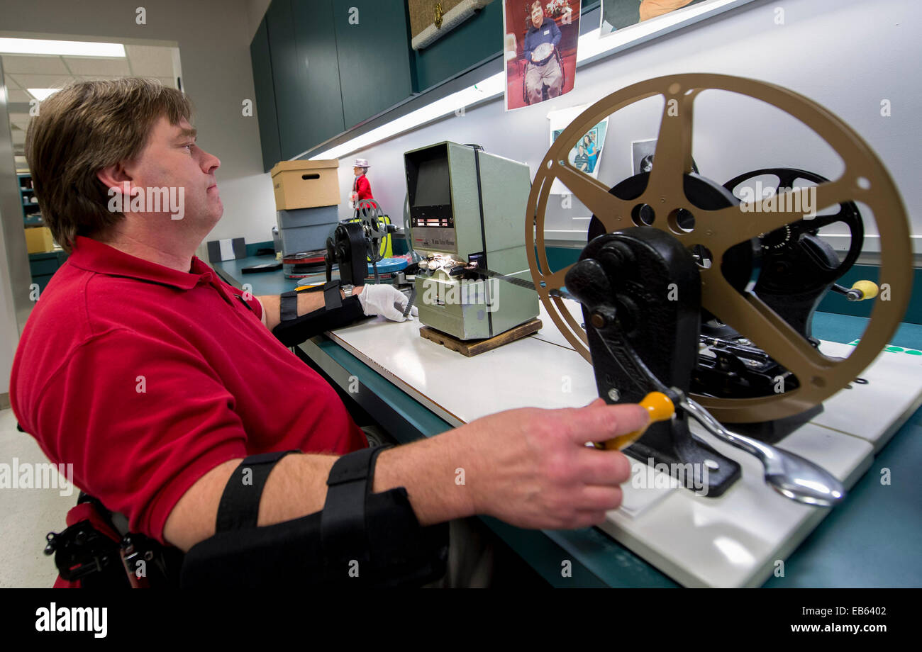 Tuscaloosa, Alabama, USA. 26th Nov, 2014. KENNY DENTON restores and splices old game film on a Moviola in the offices at the Paul W. Bryant Museum on the campus of the University of Alabama. The museum honors the history of football at the school, with special emphasis on the legendary coach, Paul ''Bear'' Bryant. The 2014 Iron Bowl Game will be played at Bryant-Denny Stadium in Tuscaloosa on November 29 against Auburn University. © Brian Cahn/ZUMA Wire/Alamy Live News Stock Photo