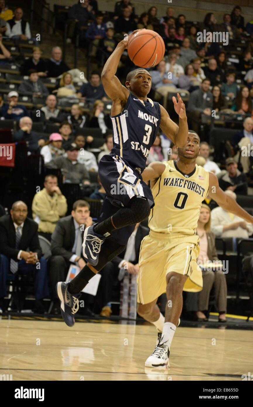 November 26, 2014:Mount St. Mary's Mountaineers guard Lamont Robinson #3  dives the baseline past Wake Forest Demon Deacons guard Codi  Miller-McIntyre #0 in the second half at the LJVM Coliseum in Winston-Salem,