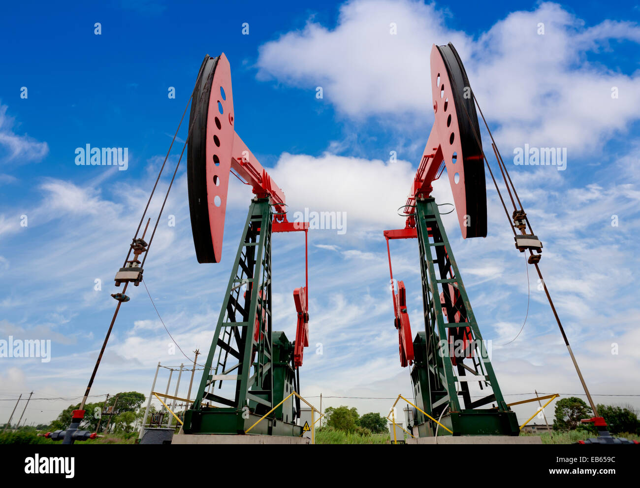 Working oil pump jacks on a oil field Stock Photo Alamy