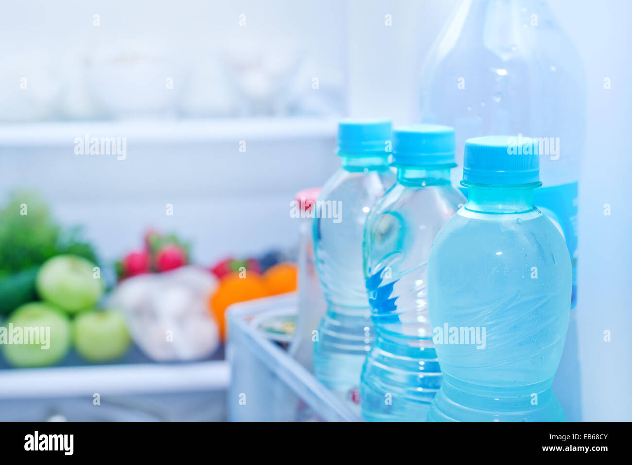 Refrigerator full of food, water in bottles Stock Photo Alamy