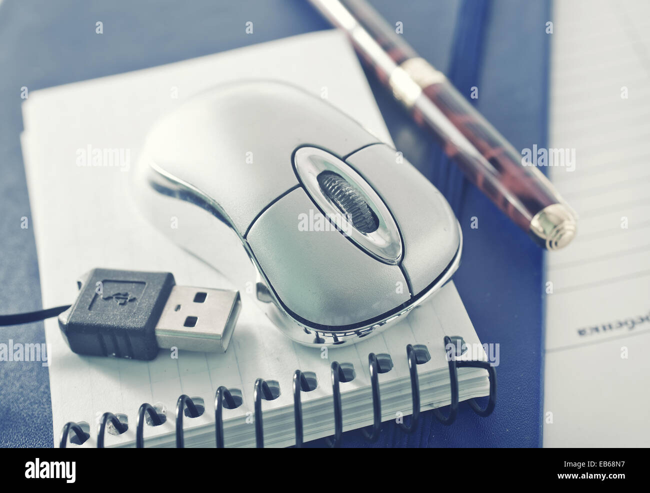 computer mouse and notebooks on a table Stock Photo - Alamy