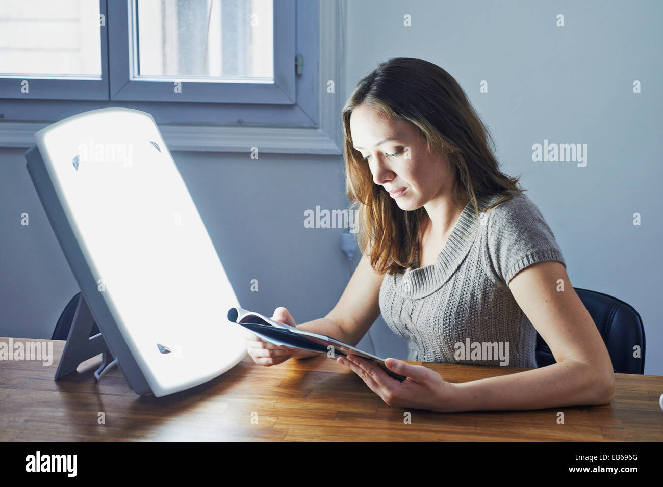 WOMAN LIGHT THERAPY Stock Photo