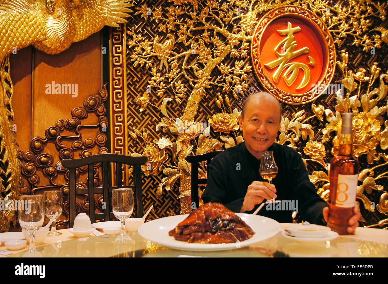 Owner of the famed Ying Kee restaurant since 1942 drinking Tariquet