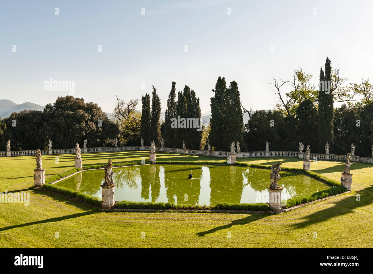 The romantic gardens of the early 18c Villa Trissino Marzotto, Vicenza, Italy. The pool in the lower garden, surrounded by statues by Orazio Marinali Stock Photo