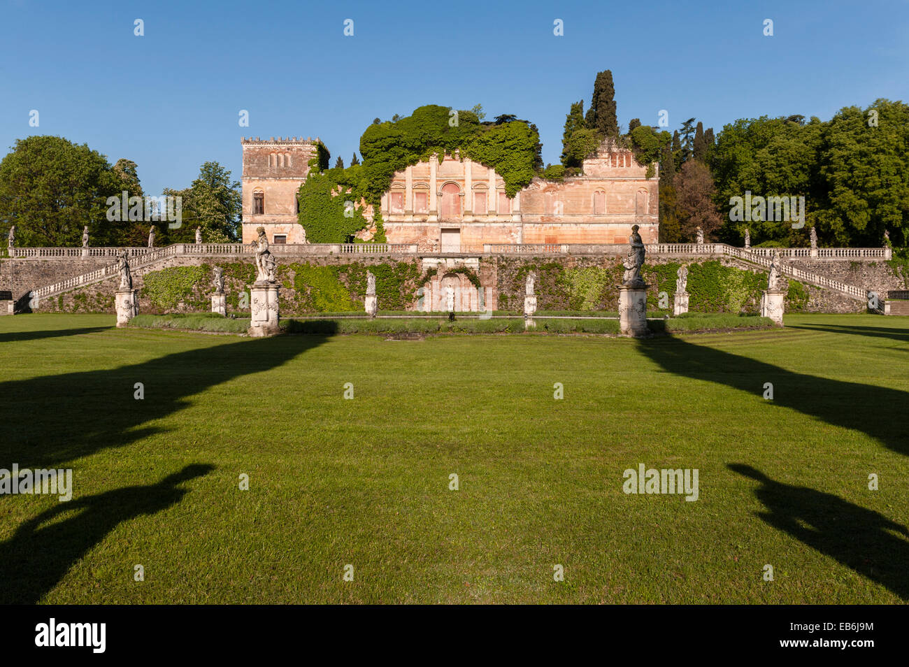 The gardens of the 18c Villa Trissino Marzotto, Vicenza, Italy. The garden below the ruined lower villa is filled with statues by Orazio Marinali Stock Photo
