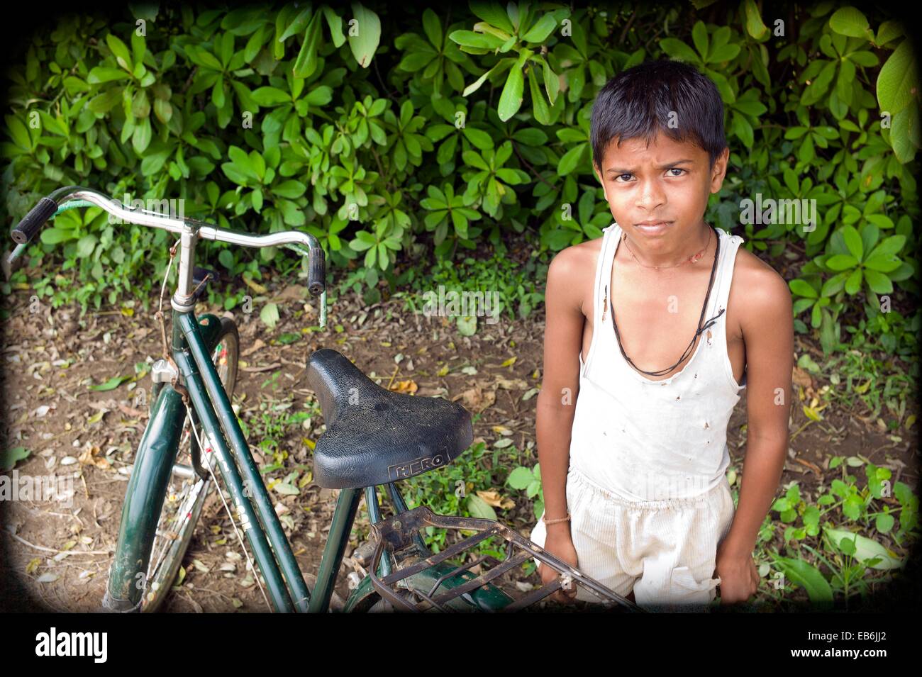 Indian kid on cycle hi-res stock photography and images - Alamy
