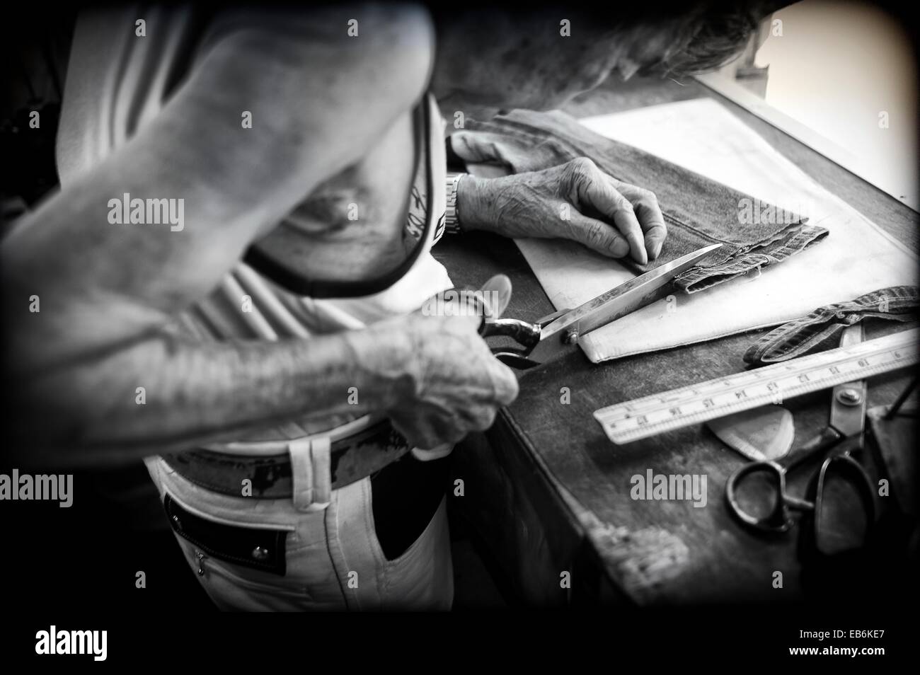 Hong Kong, Spotlight tailor working in his Stock Photo Alamy