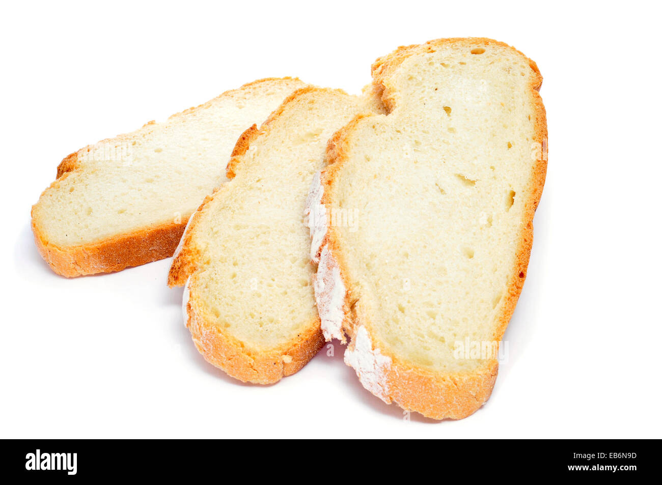 some slices of pan de payes, a round bread typical of Catalonia, Spain, on a white background Stock Photo