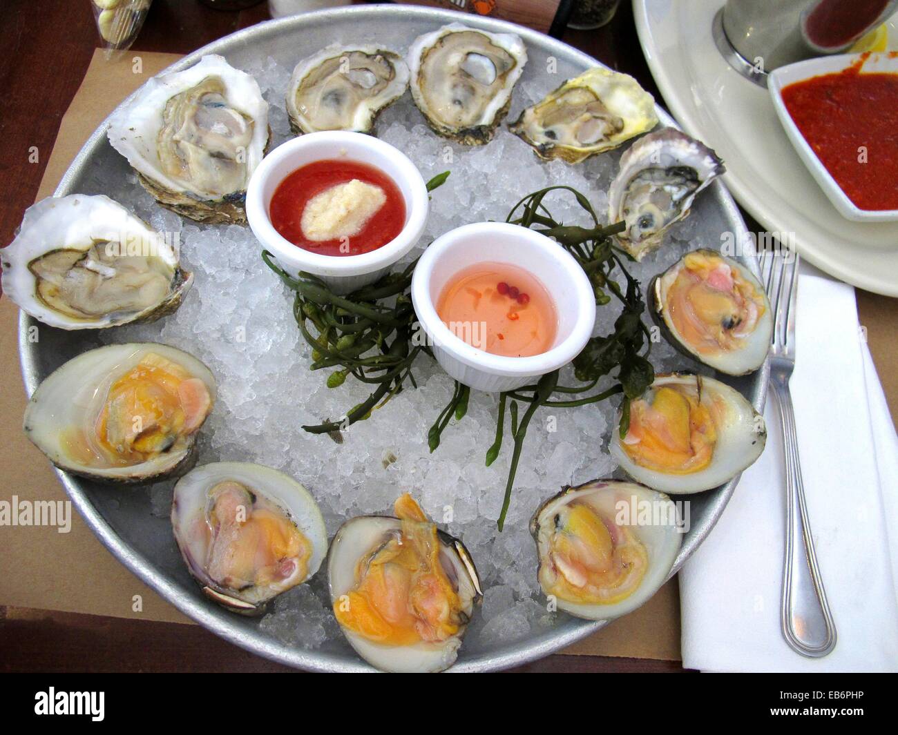 Happy hour menu, top neck clams and oysters at City Crab restaurant