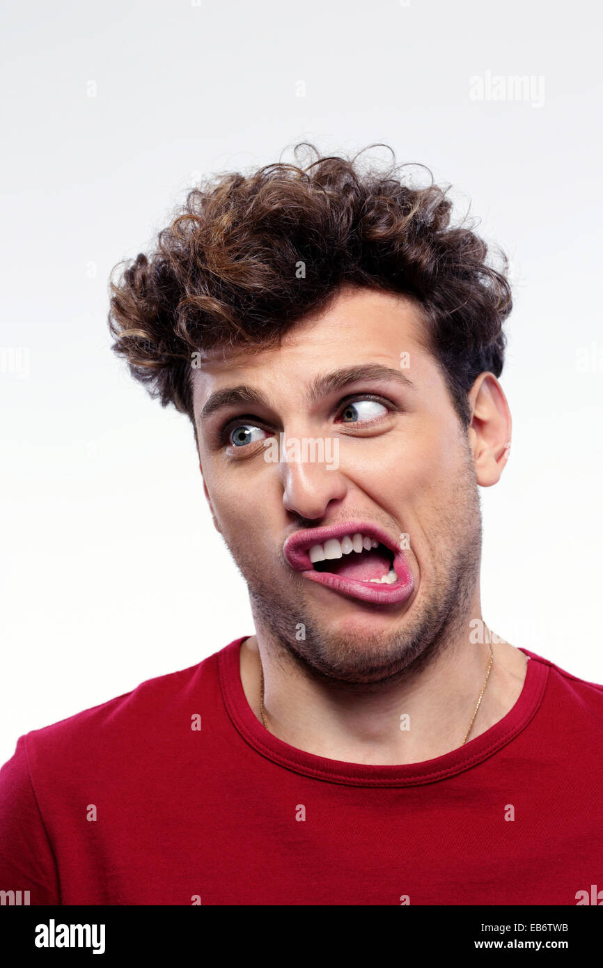 Portrait of a young man with funny expression on his face Stock Photo
