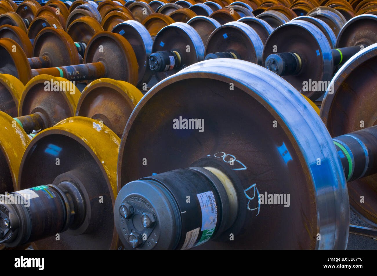 Railroad train wheel and axle assemblies at manufacturing plant,