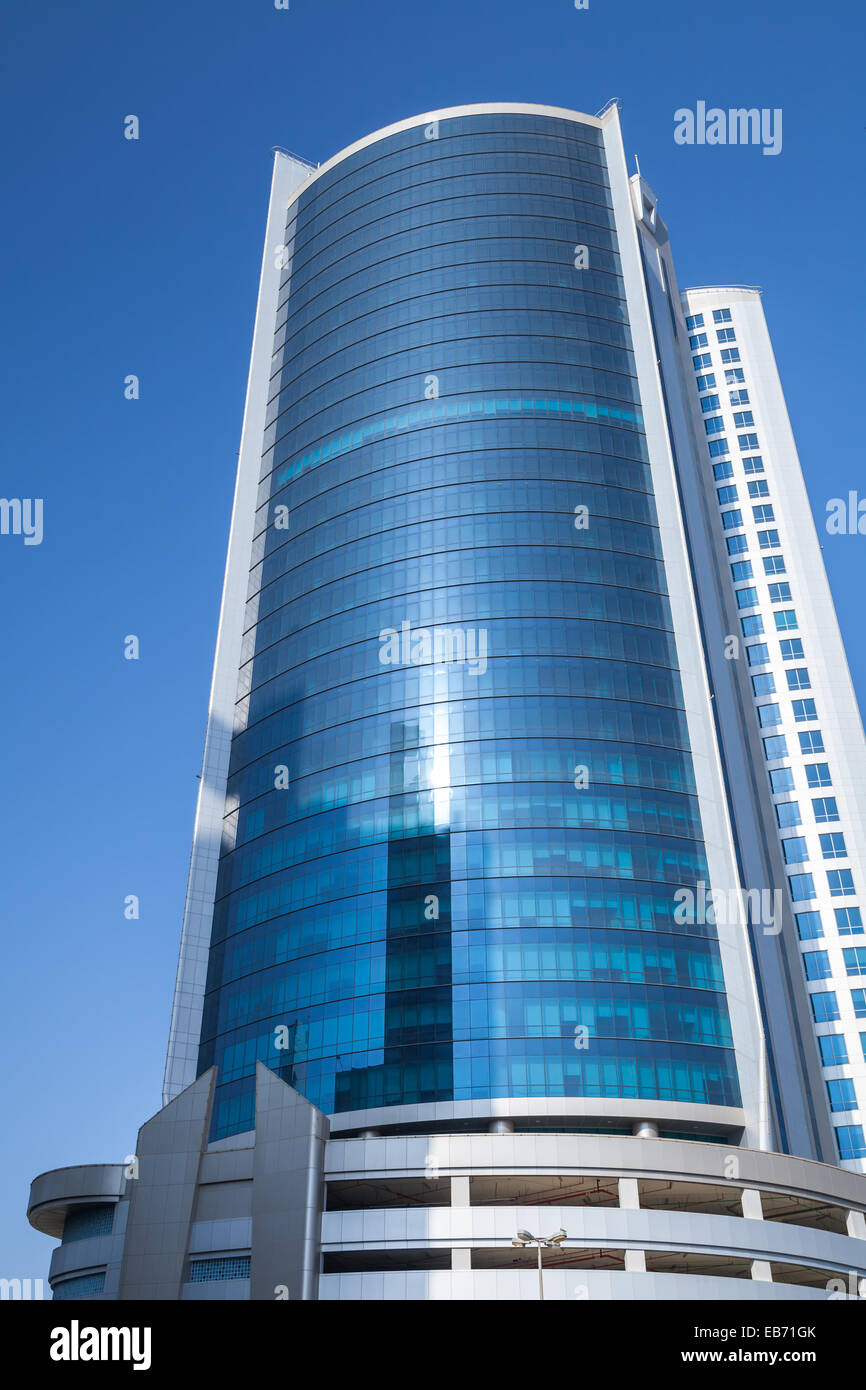 Manama, Bahrain - November 21, 2014: Diplomat Commercial Office Tower in Manama city on blue sky background Stock Photo