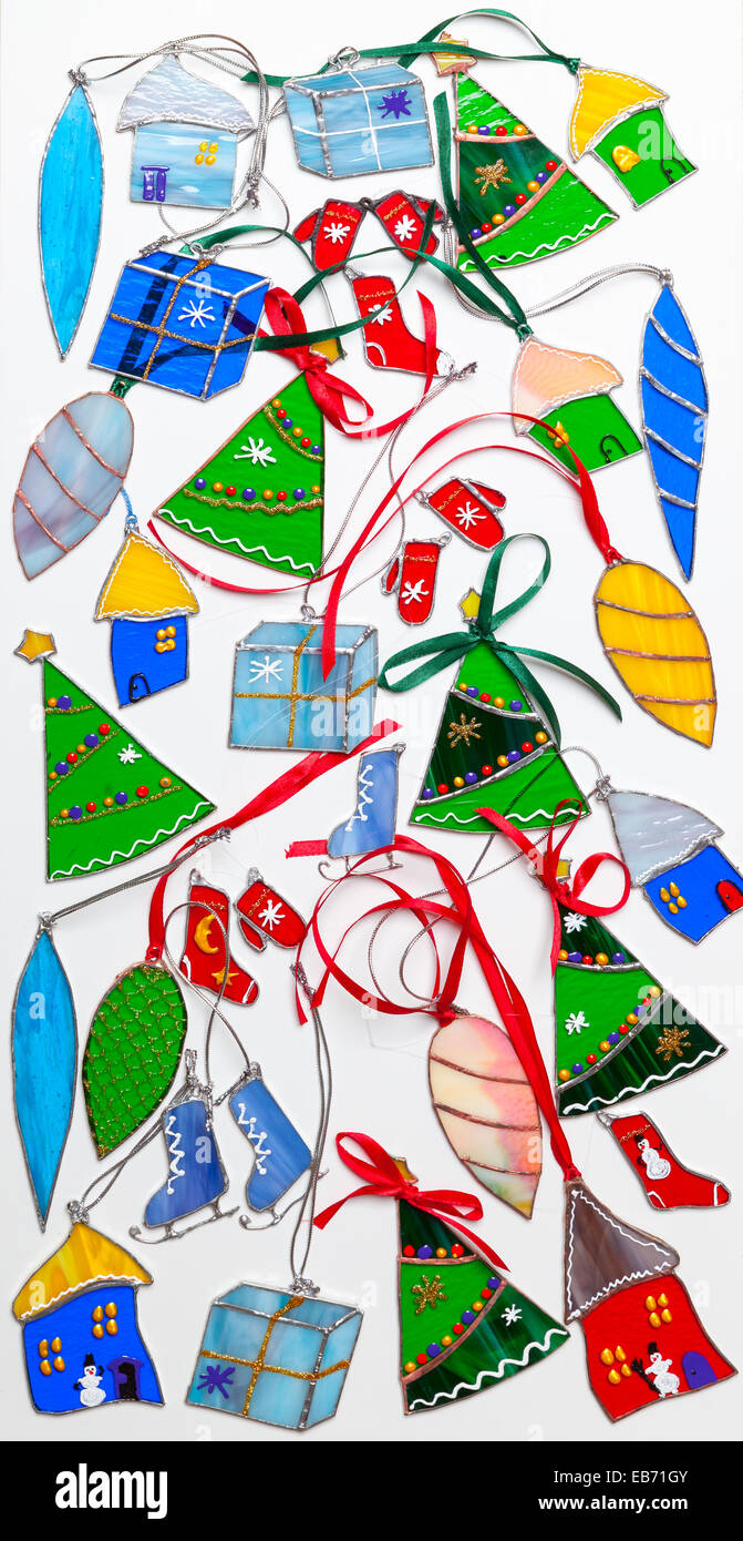 Set of stained glass handmade Christmas decor items on white background Stock Photo