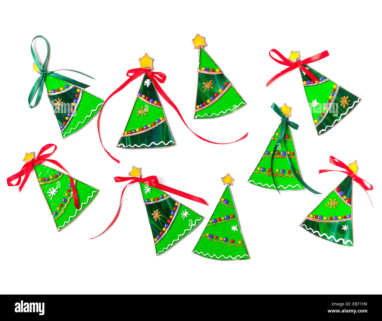 Set of stained glass handmade Christmas trees on white background Stock Photo