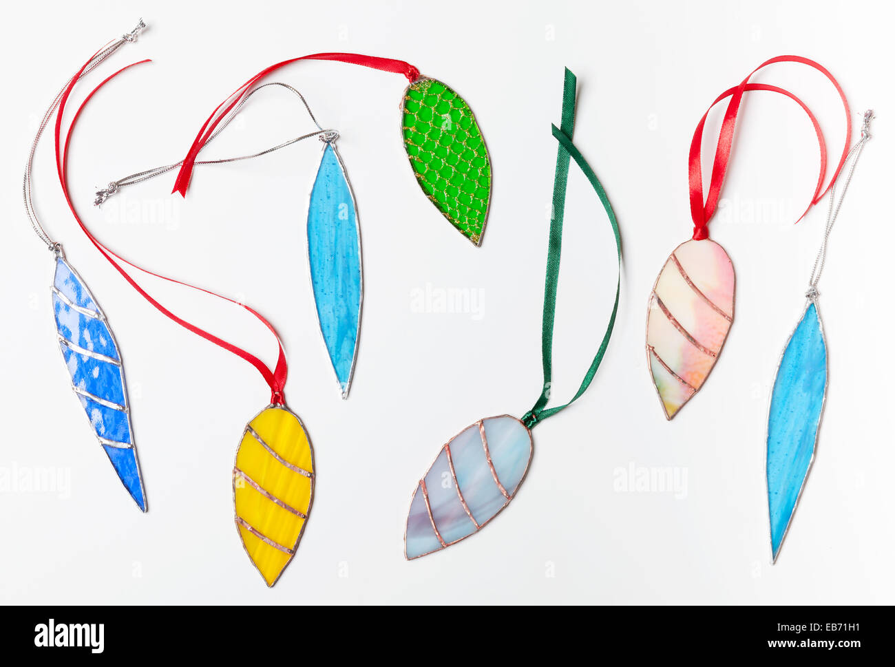 Set of stained glass handmade Christmas decor items on white background Stock Photo