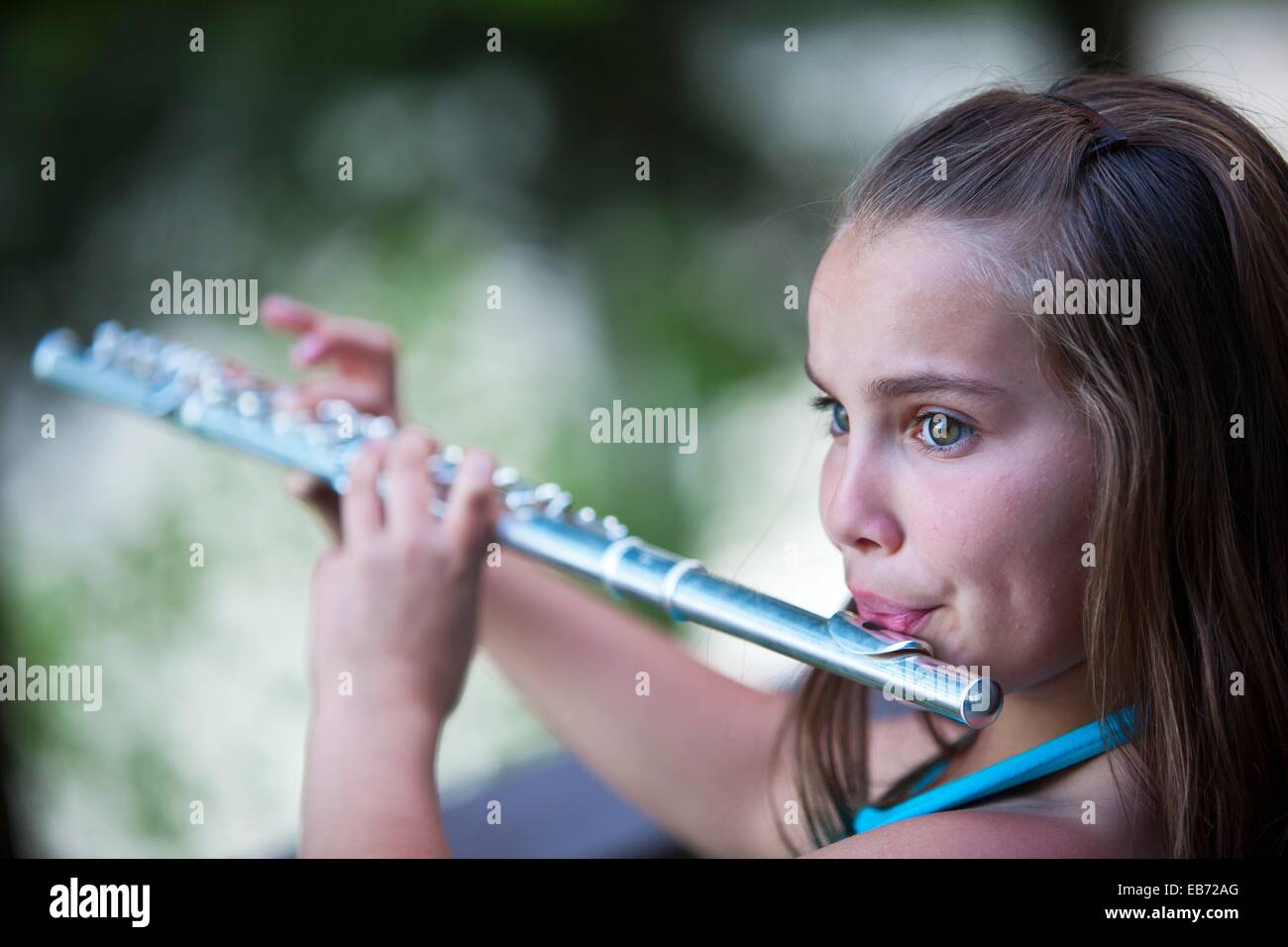 young girl playing flute Stock Photo Alamy