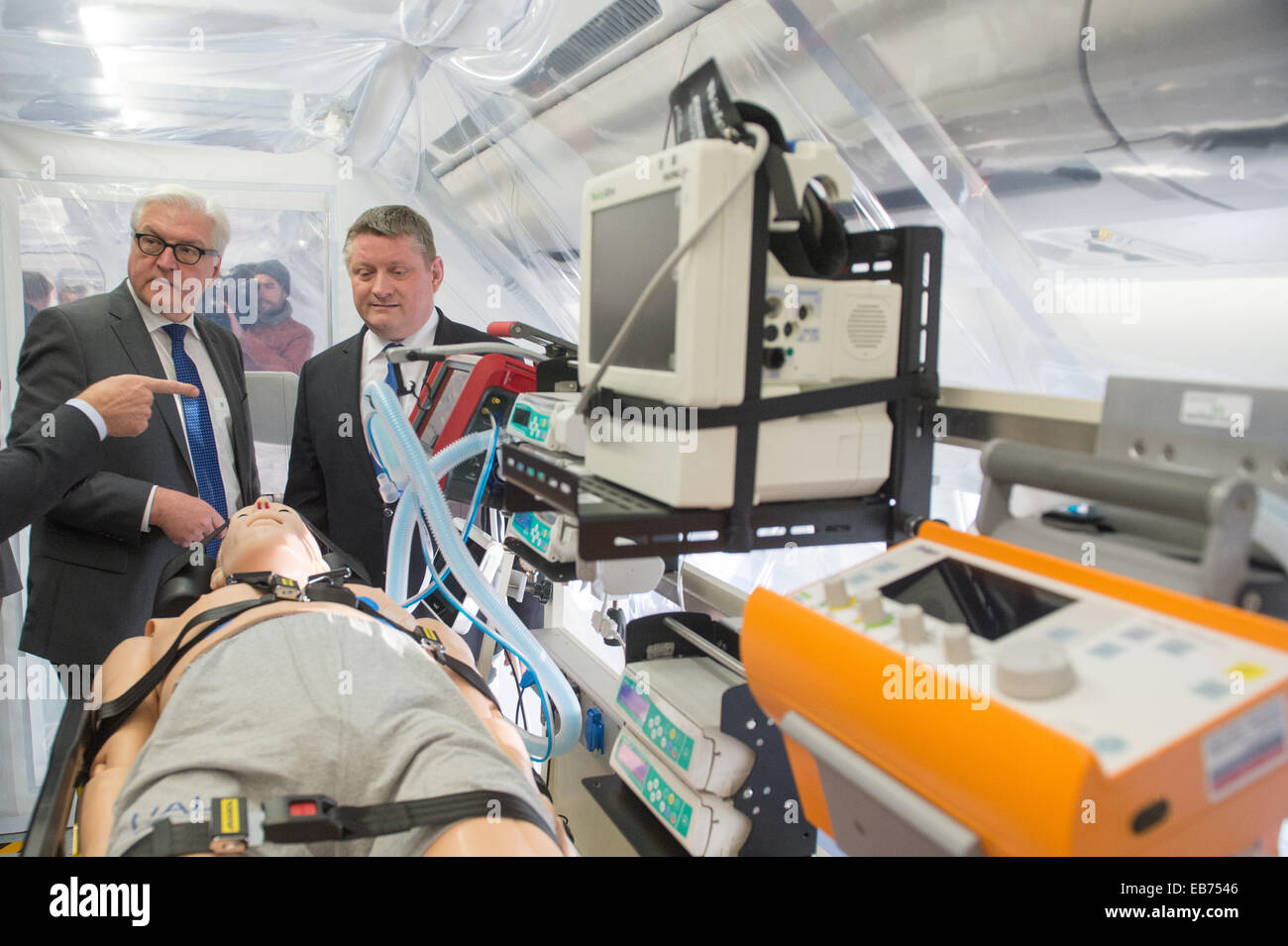 German Foreign Minister Frank-Walter Steinmeier (L) and Health Minister Hermann Groehe tour the 'Robert Koch' evacuation plane at Tegel Airport in Berlin, Germany, 27 November 2014. The Airbus A340 has an isolation unit for highly infectious patients with for example ebola. Photo: MAURIZIO GAMBARINI/dpa Stock Photo