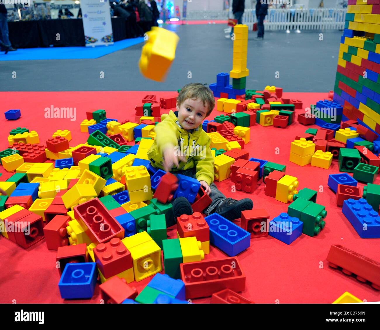 LEGO.  Ryuu, aged 3 from Redditch enjoys throwing large LEGO bricks at BRICK2014. Stock Photo