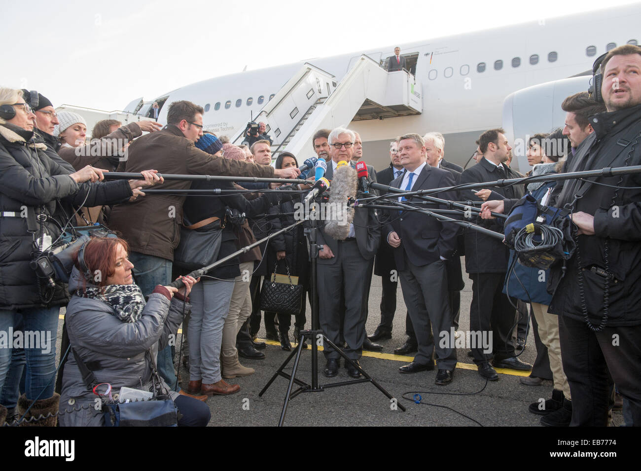 Berlin, Germany. 27th Nov, 2014. German Foreign Minister Frank-Walter Steinmeier (L) and Health Minister Hermann Groehe make a statement after touring the 'Robert Koch' evacuation plane at Tegel Airport in Berlin, Germany, 27 November 2014. The Airbus A340 has an isolation unit for highly infectious patients with for example ebola. Photo: MAURIZIO GAMBARINI/dpa/Alamy Live News Stock Photo
