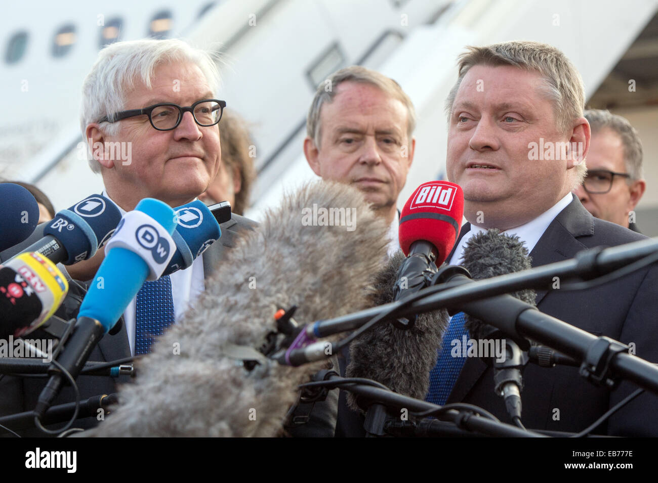 Berlin, Germany. 27th Nov, 2014. German Foreign Minister Frank-Walter Steinmeier (L) and Health Minister Hermann Groehe make a statement after touring the 'Robert Koch' evacuation plane at Tegel Airport in Berlin, Germany, 27 November 2014. The Airbus A340 has an isolation unit for highly infectious patients with for example ebola. Photo: MAURIZIO GAMBARINI/dpa/Alamy Live News Stock Photo