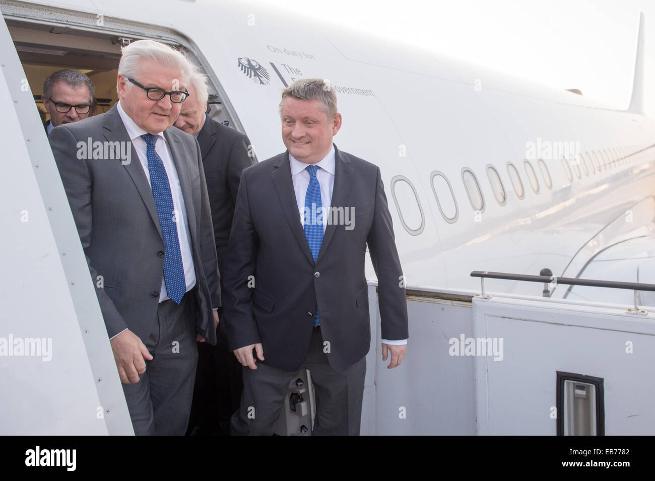 Berlin, Germany. 27th Nov, 2014. German Foreign Minister Frank-Walter Steinmeier (L) and Health Minister Hermann Groehe after touring the 'Robert Koch' evacuation plane at Tegel Airport in Berlin, Germany, 27 November 2014. The Airbus A340 has an isolation unit for highly infectious patients with for example ebola. Photo: MAURIZIO GAMBARINI/dpa/Alamy Live News Stock Photo