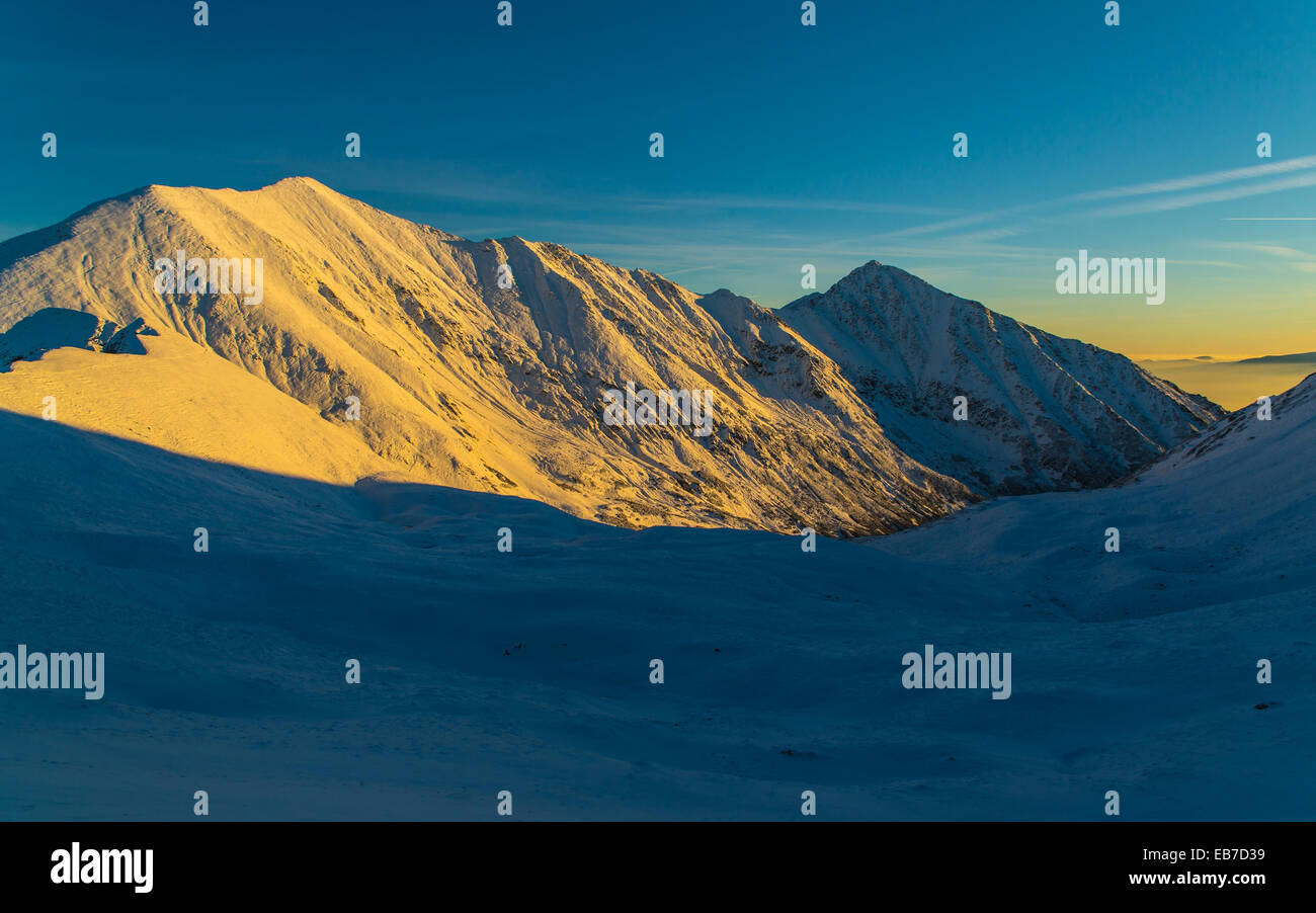 Sunset mountains above clouds - Tatra Mountains in Poland Stock Photo ...