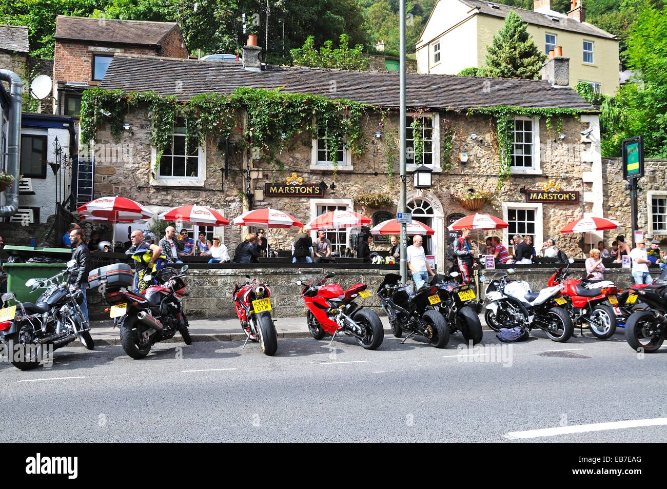 Motor cyclists outside a Marstons pub in the town centre, Matlock Bath, Derbyshire, England, UK, Western Europe. Stock Photo